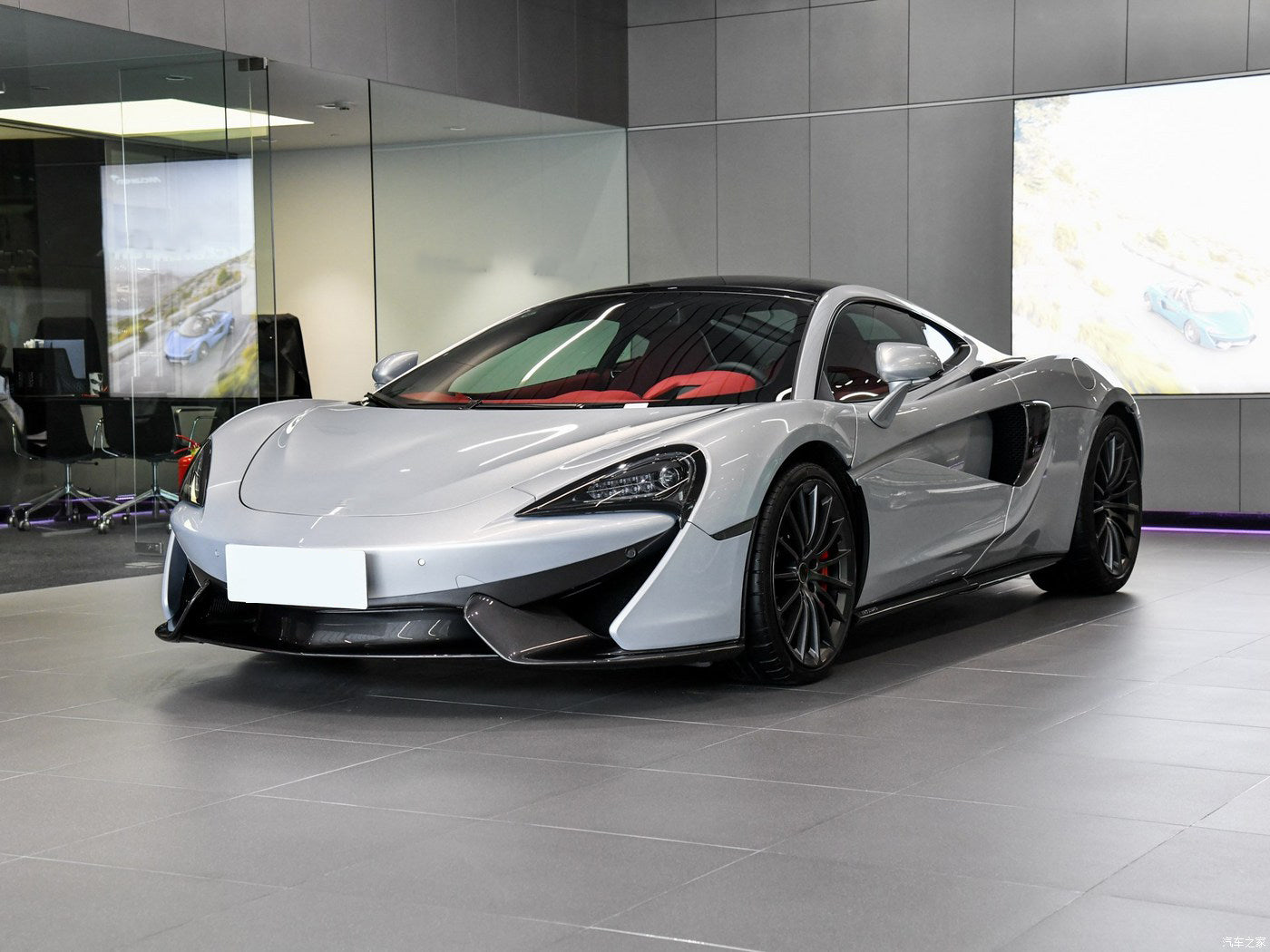 Silver sports car in a showroom setting