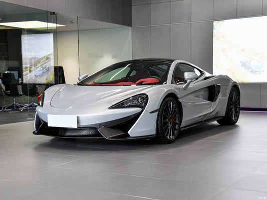 Silver sports car in a showroom setting